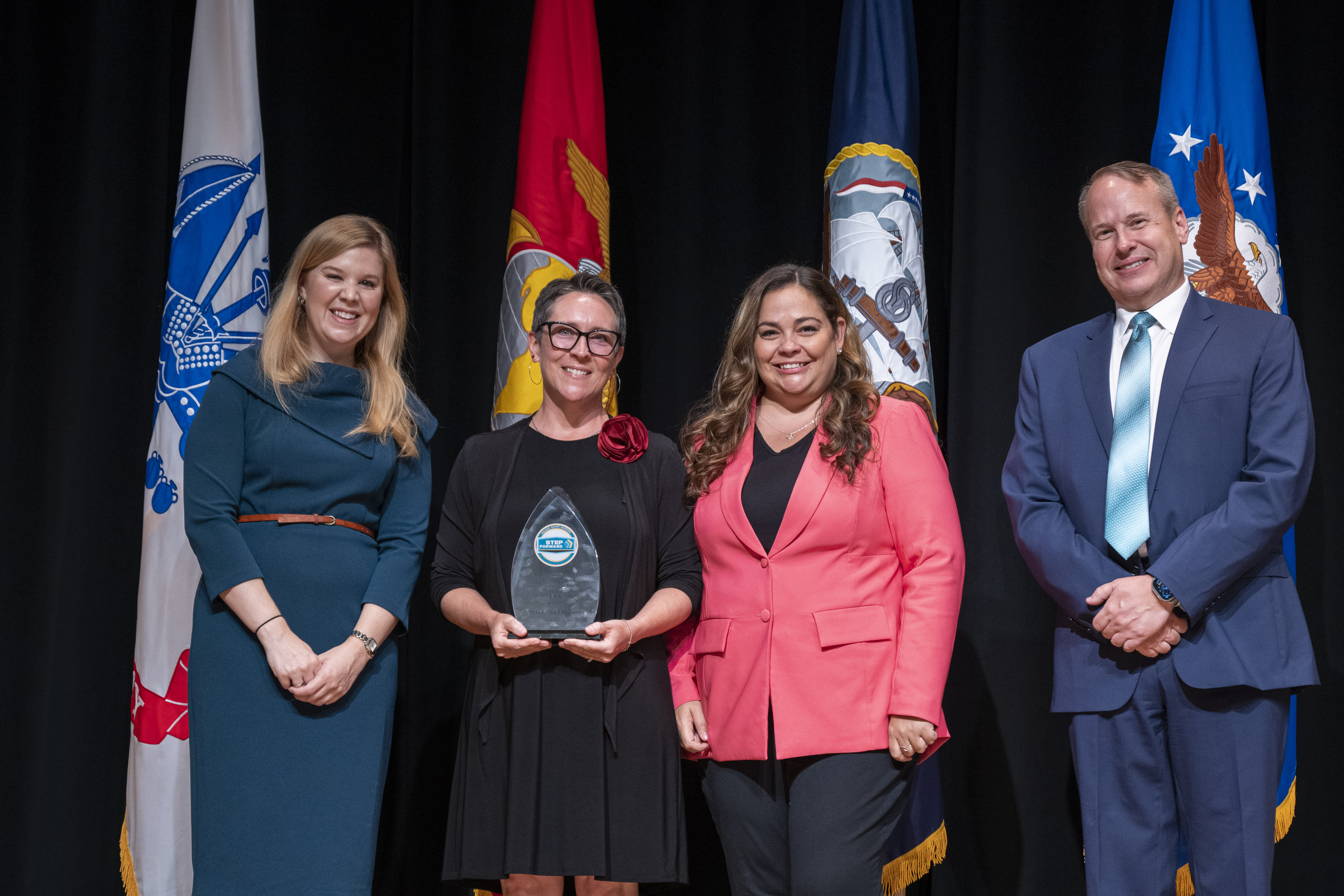 Ms. Tina Vaughn-Wardle and Ms. Portal receiving an award for their initiative.