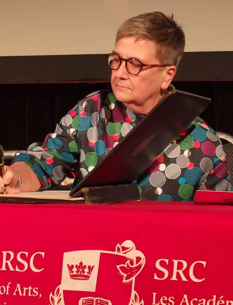 Dr. Senn signing her induction into the Royal Society of Canada